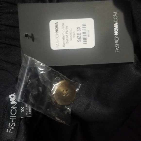 Black stretch belted pants. - Picture 5 of 5